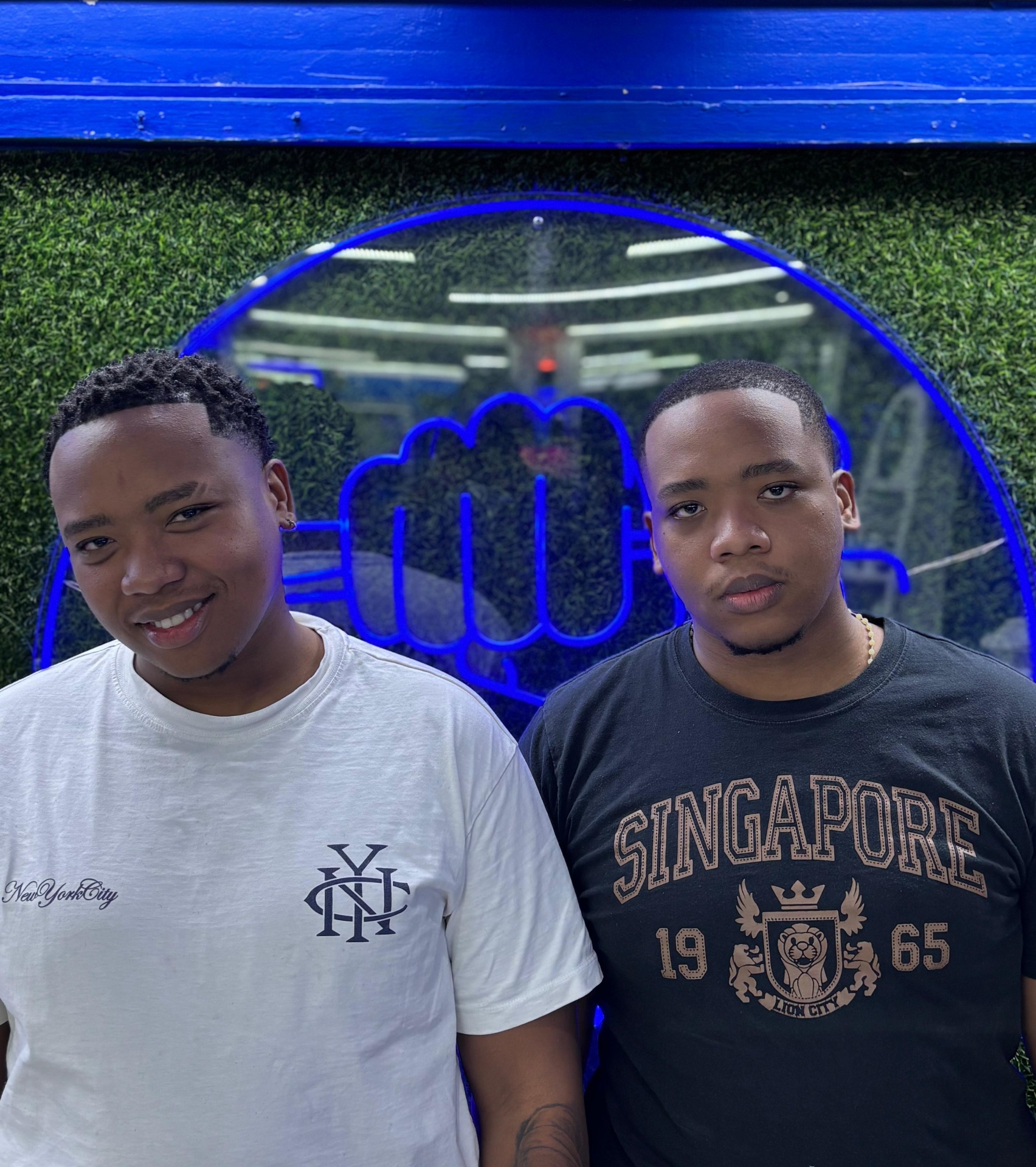 Two Chico's customers in front of the shop sign