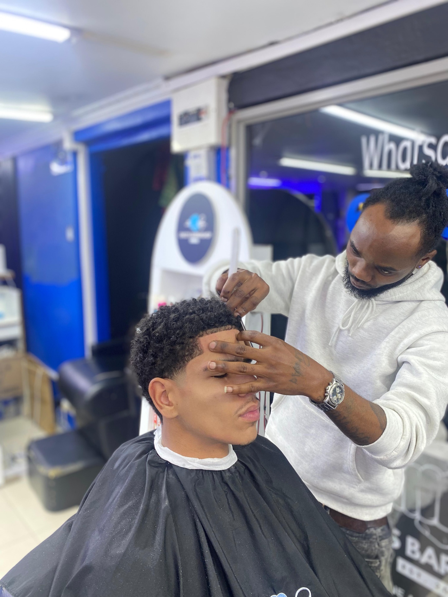 A Chico's barber shaping a client's haircut